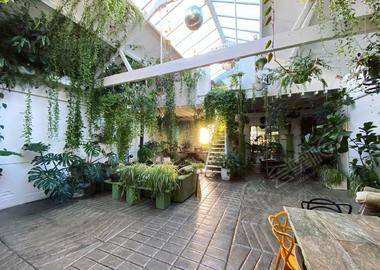 Plant filled Victorian stable in old Tram Depot